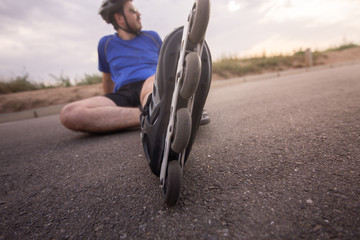 man with inline skates skating on the street