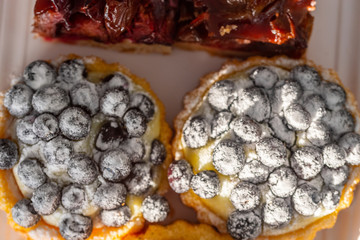 A delicious piece of fine cake with fruits on top