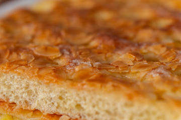 A delicious piece of fine cake with fruits on top