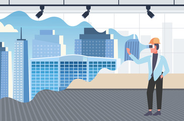 Obraz premium man architect in helmet wearing digital glasses virtual reality 3d building city model vr modeling headset vision concept modern office interior horizontal full length flat