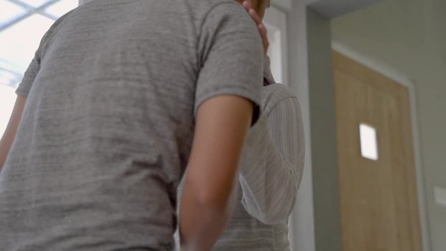 pregnant woman kiss her husband's hand at home