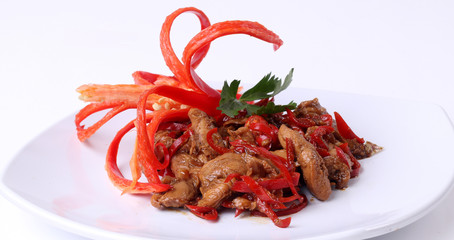 Vegetarian food delicious stir fry oyster mushrooms with red chili on white plate 