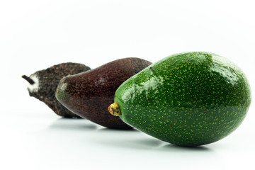 Three generations, raw, ripe and rotten Avocados great tropical smooth oily fresh healthy organic fruit isolated on white background.
