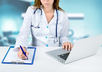 Close-up Doctor at hospital working with laptop