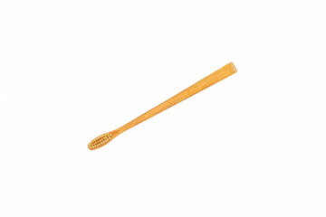 Bamboo toothbrush on white background.