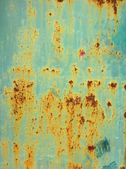 Rusty old metal blue green door detail for background  