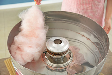 Woman making cotton candy at fair