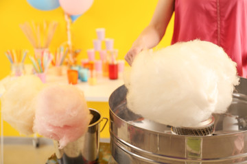 Woman making cotton candy at fair