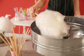 Woman making cotton candy at fair