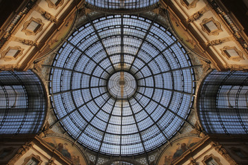 Symmetry sun light roof top above the marvellous interior decoration design of The Galleria Vittorio Emanuele II in Milan, Italy, The oldest shopping mall of Milan.