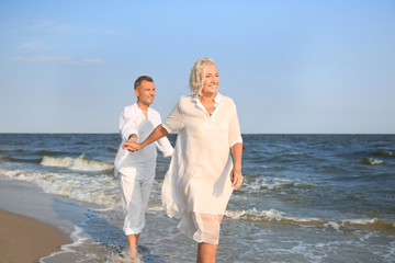 Happy mature couple at sea resort