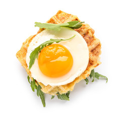 Tasty squash waffles with fried egg on white background