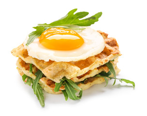 Tasty squash waffles with fried egg on white background