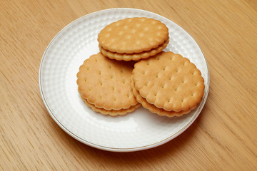 cookies on a plate wooden background