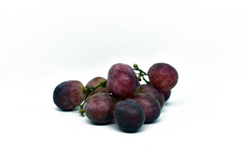 fresh red grapes isolated on a white background