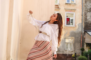 Fototapeta premium Young beautiful lady wearing a stylish white shirt.Portrait shooting of a stylish girl.Trends summer 2019.