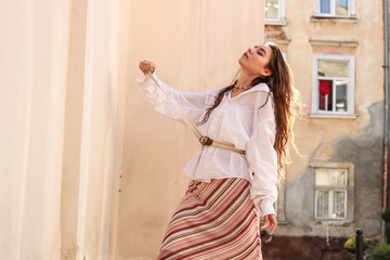 Young beautiful lady wearing a stylish white shirt.Portrait shooting of a stylish girl.Trends summer 2019.