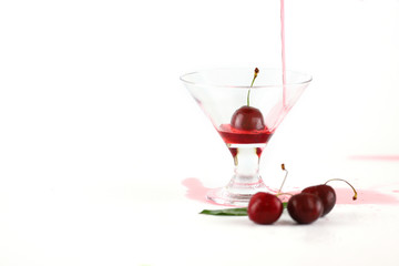 elegant cocktail fresh red cherry white background