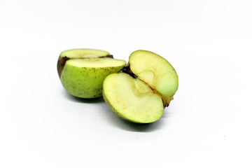 green apple cut into two parts. Isolated on white background