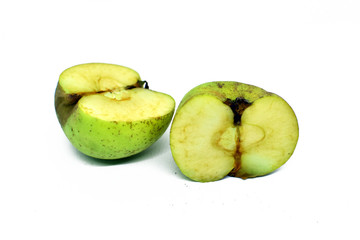 green apple cut into two parts. Isolated on white background