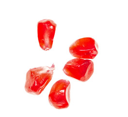 pomegranate seeds on white background