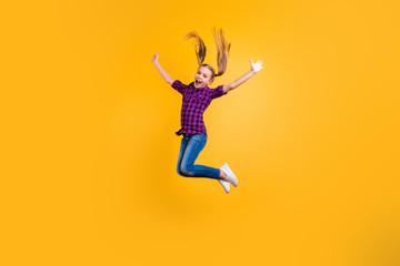 Fototapeta na wymiar Full size side photo of small pupil jump high hooray holidays wear casual checkered shirt jeans denim isolated yellow background