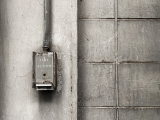 Old electric control box on the white wall of factory, Retro tone