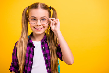 Closeup photo of little lady return school eager get knowledge wear specs new bag checkered shirt isolated yellow background