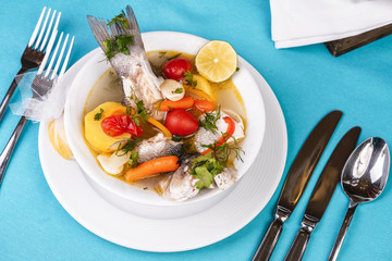 Mediterranean sea-fish soup with vegetables and lemon