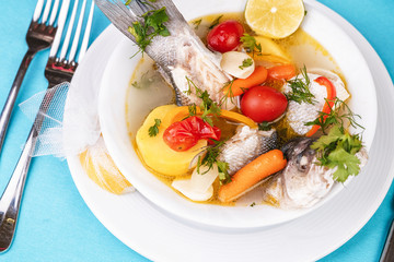 Mediterranean sea-fish soup with vegetables and lemon