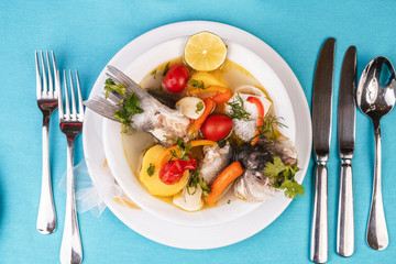 Mediterranean sea-fish soup with vegetables and lemon