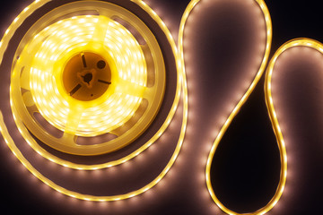 decorative LED strip home lighting on a purple-pink background top view 