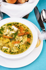 Mediterranean recipe for chicken, vegetables and seafood on a blue background