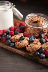 Fresh and tasty dessert made out of chocolate oatmeal cookies with raspberries