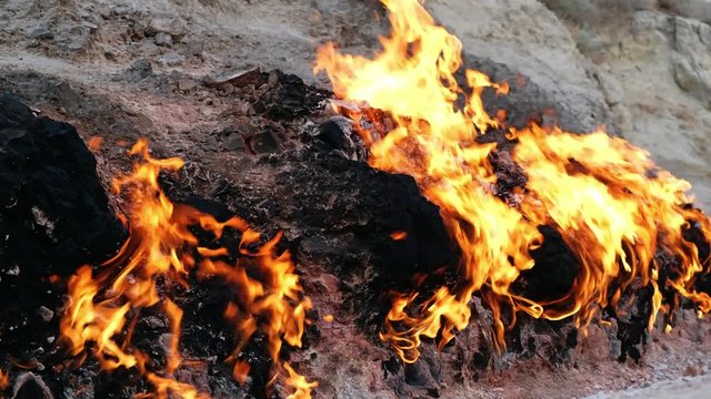  Flame of Yanar Dag (burning mountain). Natural gas is burning on the base of hill.  Azerbaijan.