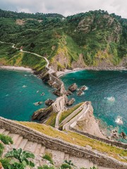 Picturesque picturesque road winding stairs to the island Gaztelugatxe on the coast of the Bay of...