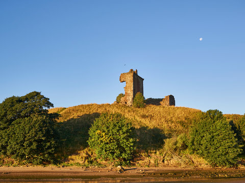 The 15th Century Remains of the Red Castle perched on a Hill overlooking Lunan Water, next to Lunan Bay near Inverkeilor in Angus, Scotland.