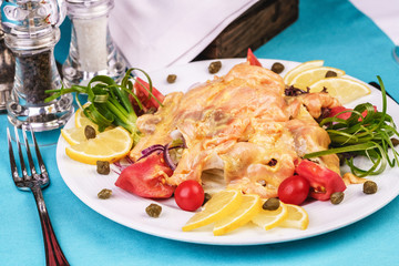 Roast with cream sauce, with Colmar, shrimps, tomatoes, decorated with nuts and onions according to...
