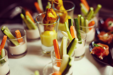 Verrines appetizer with salmon pate red caviar cucumber cream cheese herbs capers in glasses