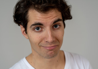 Fototapeta premium Portrait of young handsome cheerful man with smiling happy face. Human expressions and emotions