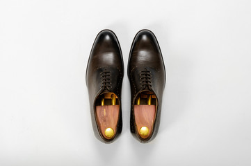Classic male leather shoes. Isolated on white background. Top view
