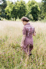woman walking in the field on a sunny day