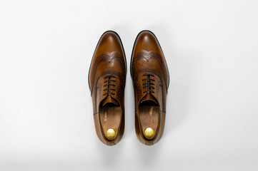 Classic male leather shoes. Isolated on white background. Top view
