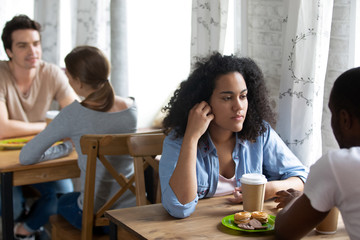 Fototapeta premium Young biracial woman attending speed dating event.