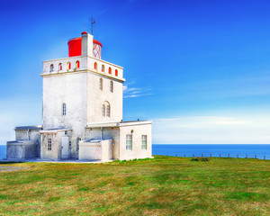 Fototapeta na wymiar Landscape with white lighthouse at Cape Dyrholaey