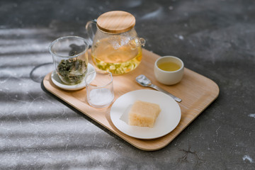 Set for tea ceremony with cake sweet traditional  on wooden tray, horizontal