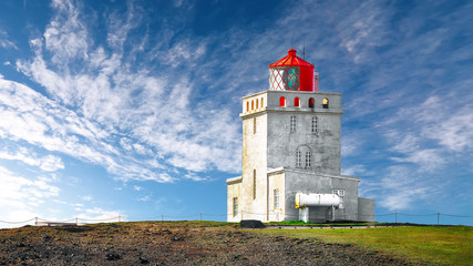 Fototapeta na wymiar Landscape with white lighthouse at Cape Dyrholaey