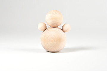 Wooden doll on a white background.
