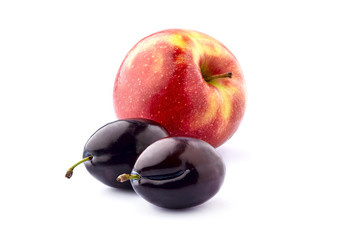 Plums   with apple isolated on white background.