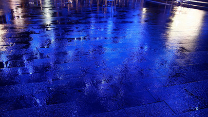 Blue Light reflection on wet rainy floor